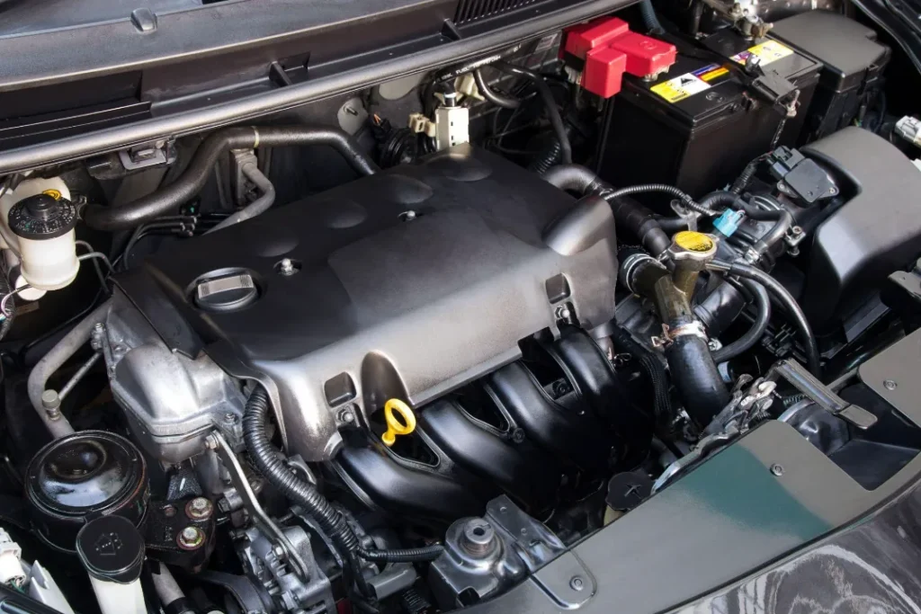 A clean and modern gasoline engine inside a car's engine bay.