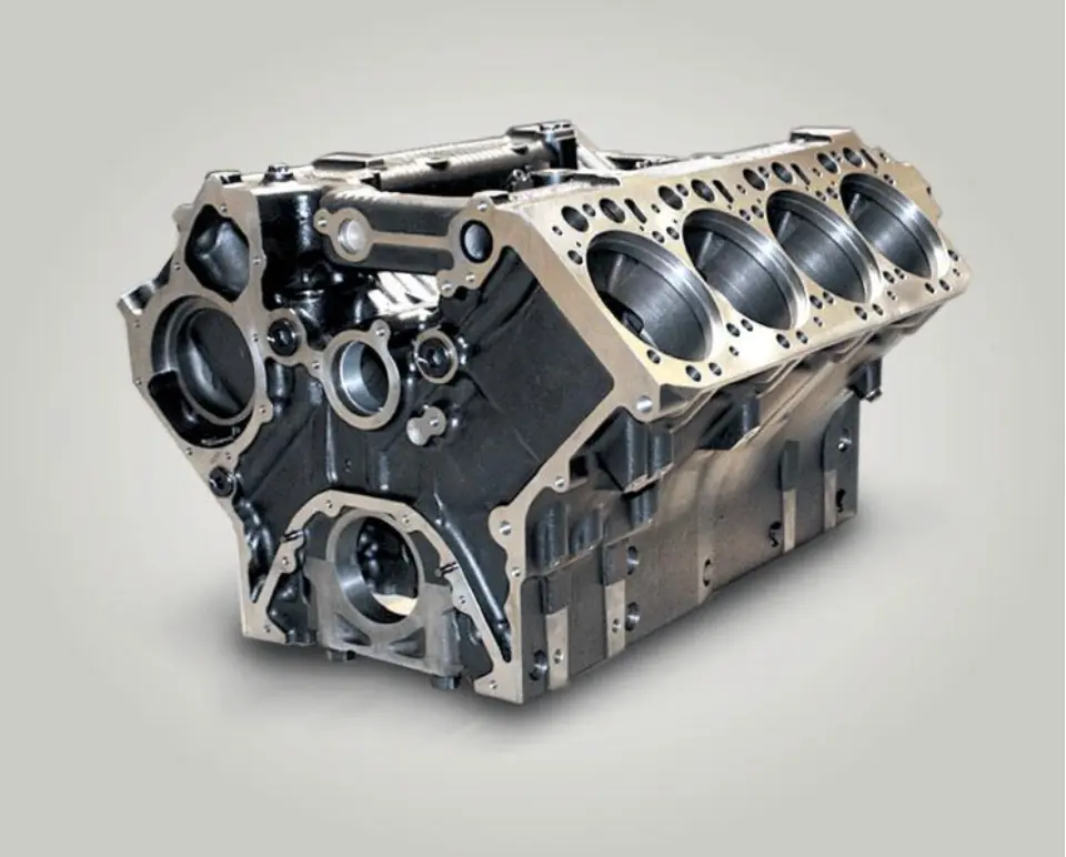 Robust, cast metal engine block with multiple cylindrical bores, representing the foundation of a diesel engine.