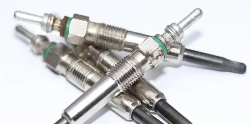 A cluster of several glow plugs, small electric heaters used for cold starting diesel engines.