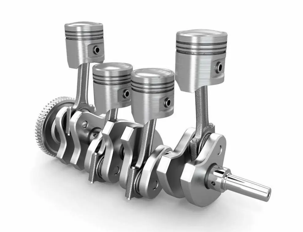 A metallic crankshaft with connecting rods attached, illustrating conversion of linear motion to rotational force.