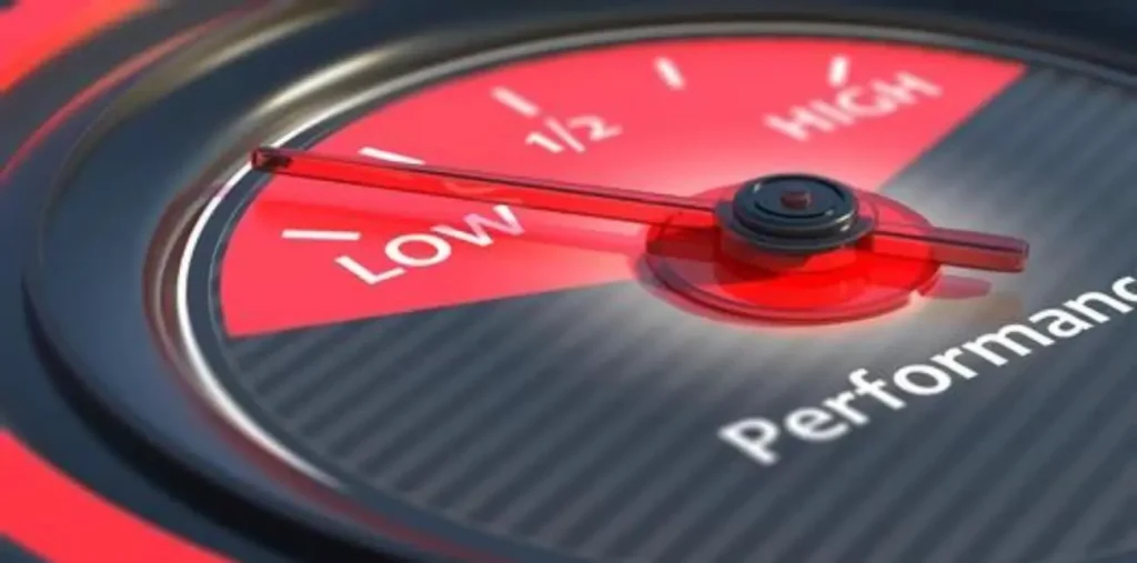 A close-up of a speedometer or gauge cluster, with the needle pointing towards a "LOW" or "Performance" warning indicator, suggesting reduced vehicle performance.